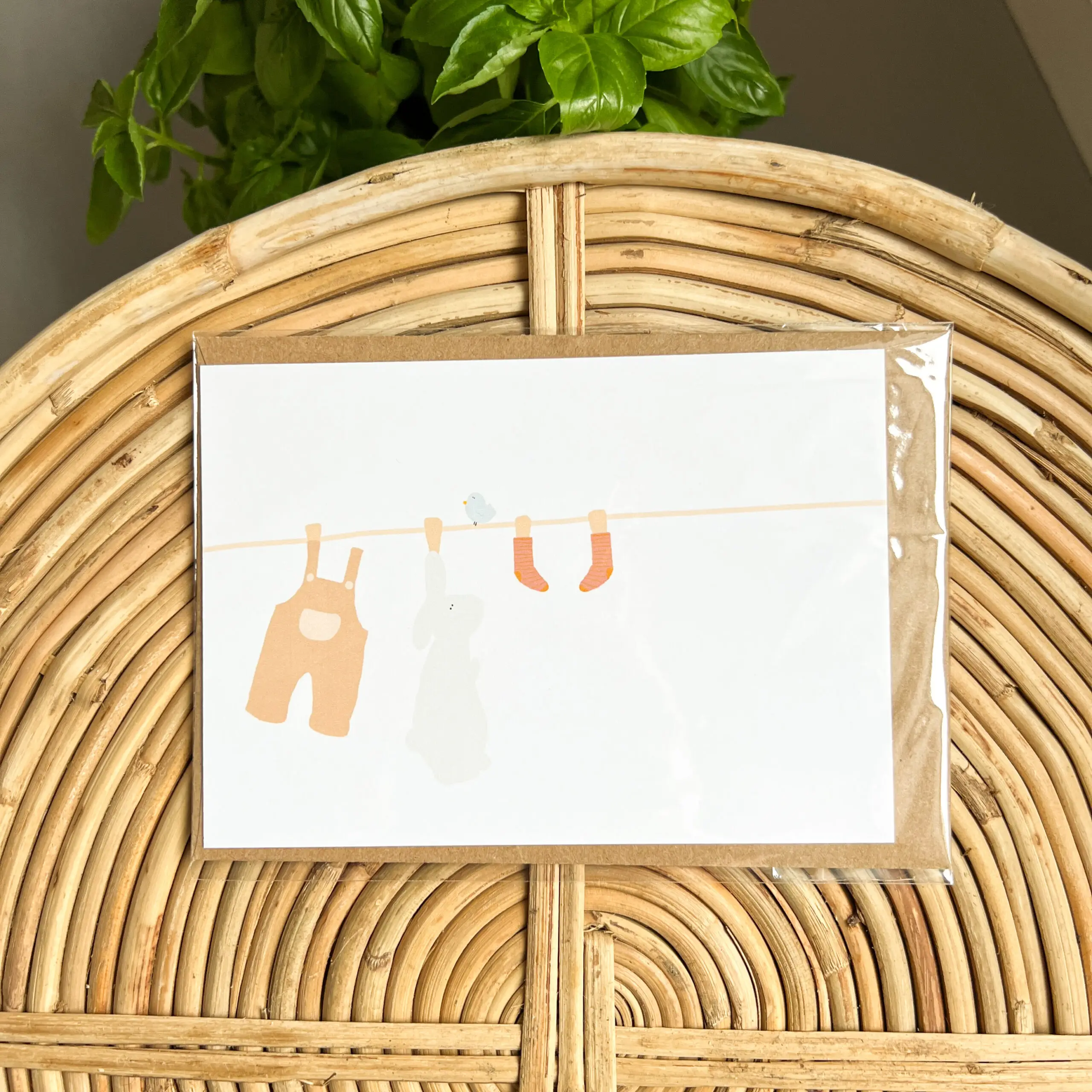 Wenskaart Babykleertjes aan de Waslijn